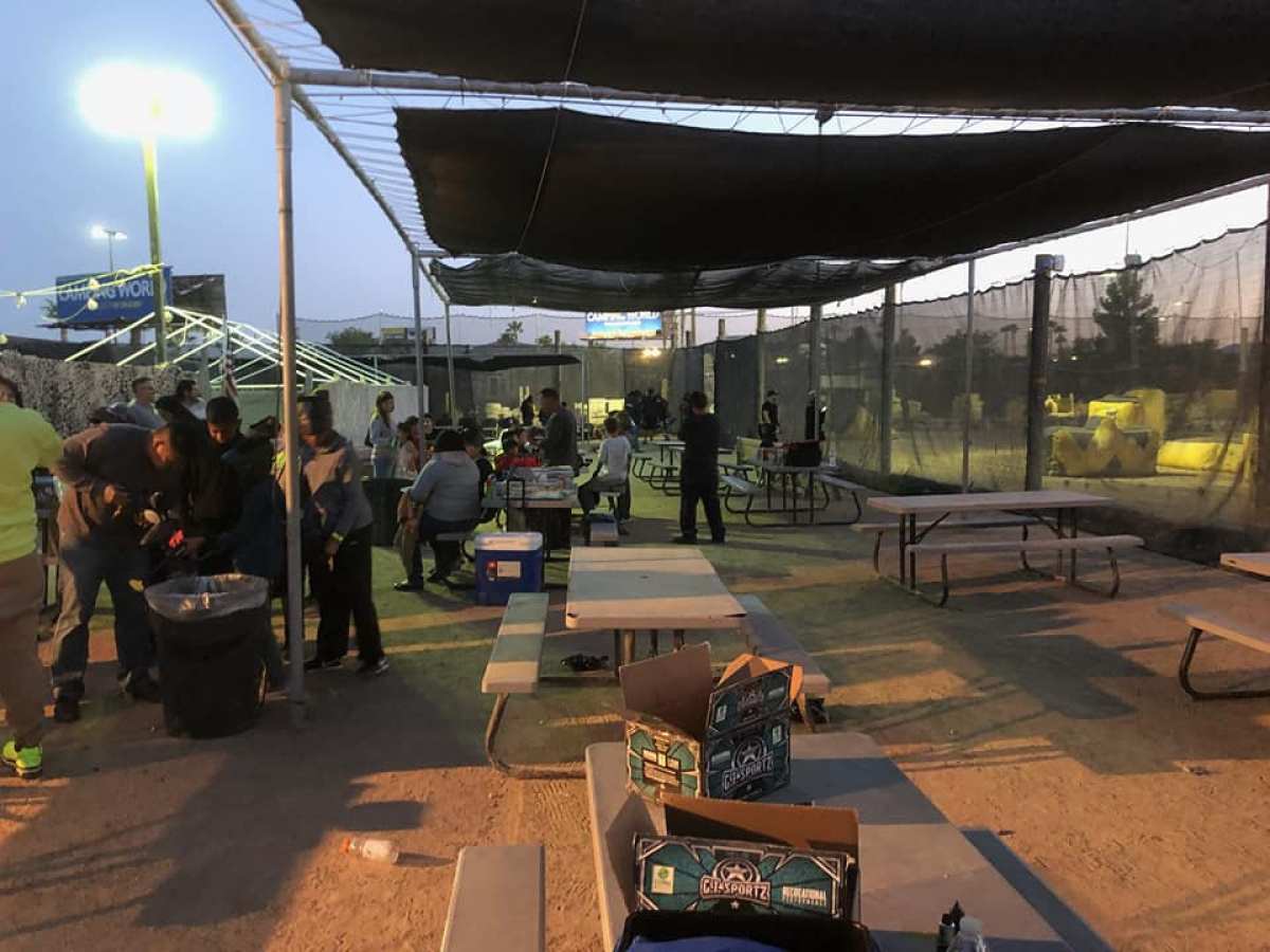 a group of people standing outside of a building