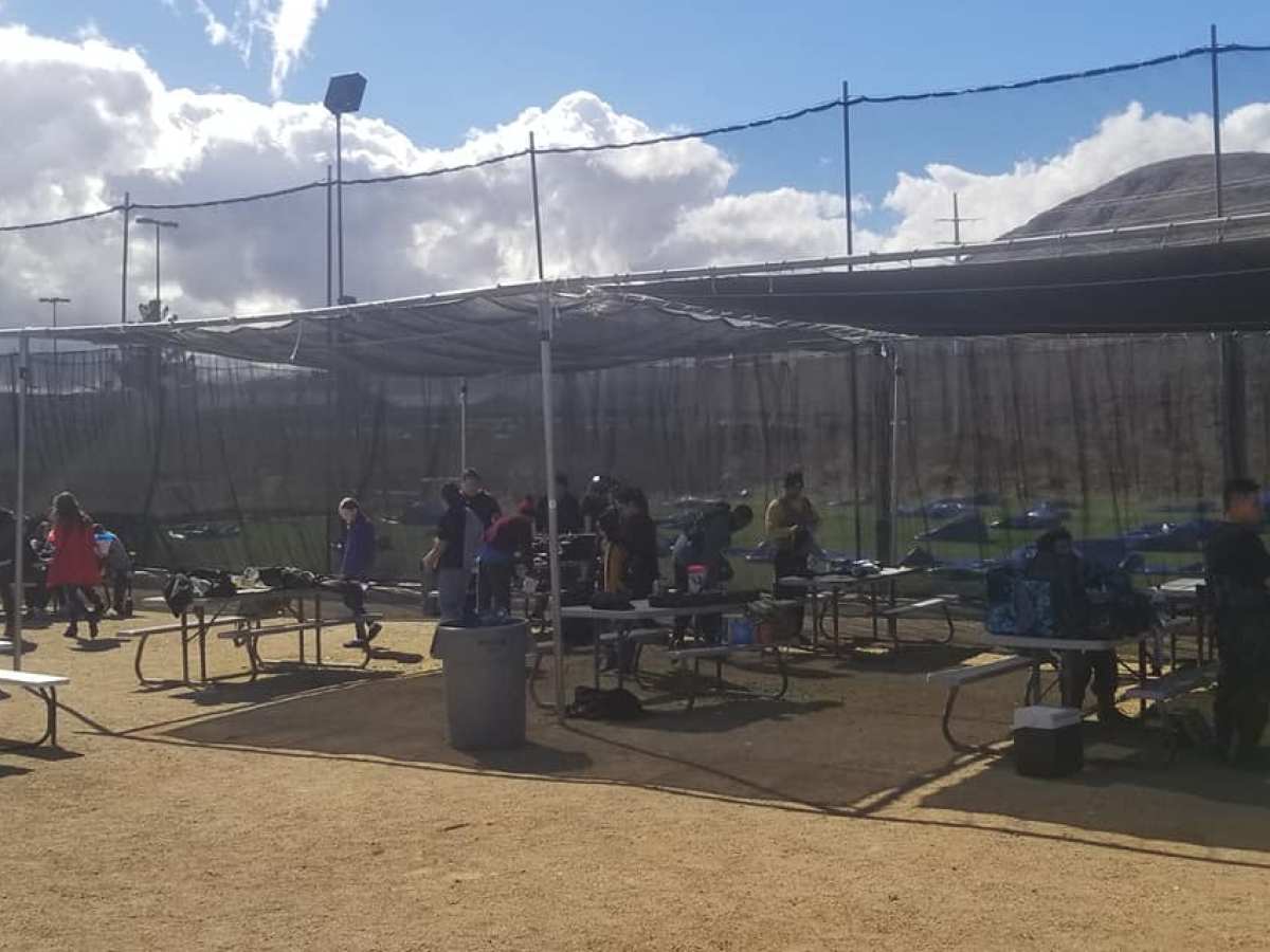 a group of people standing in front of a building