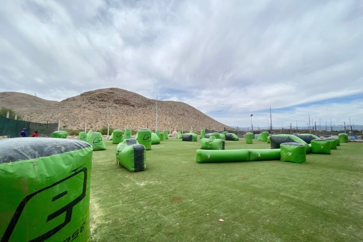 a green truck parked in a grassy field