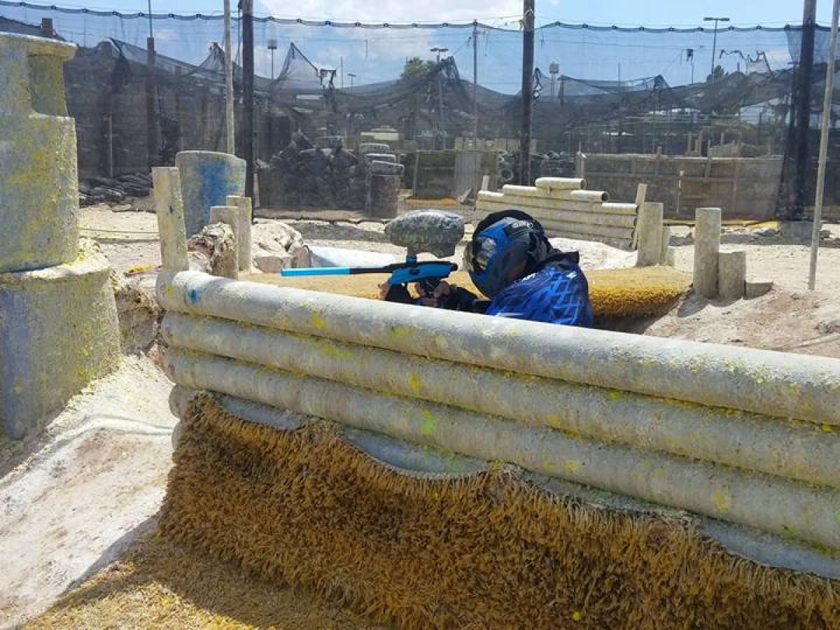 a group of men sitting at a zoo