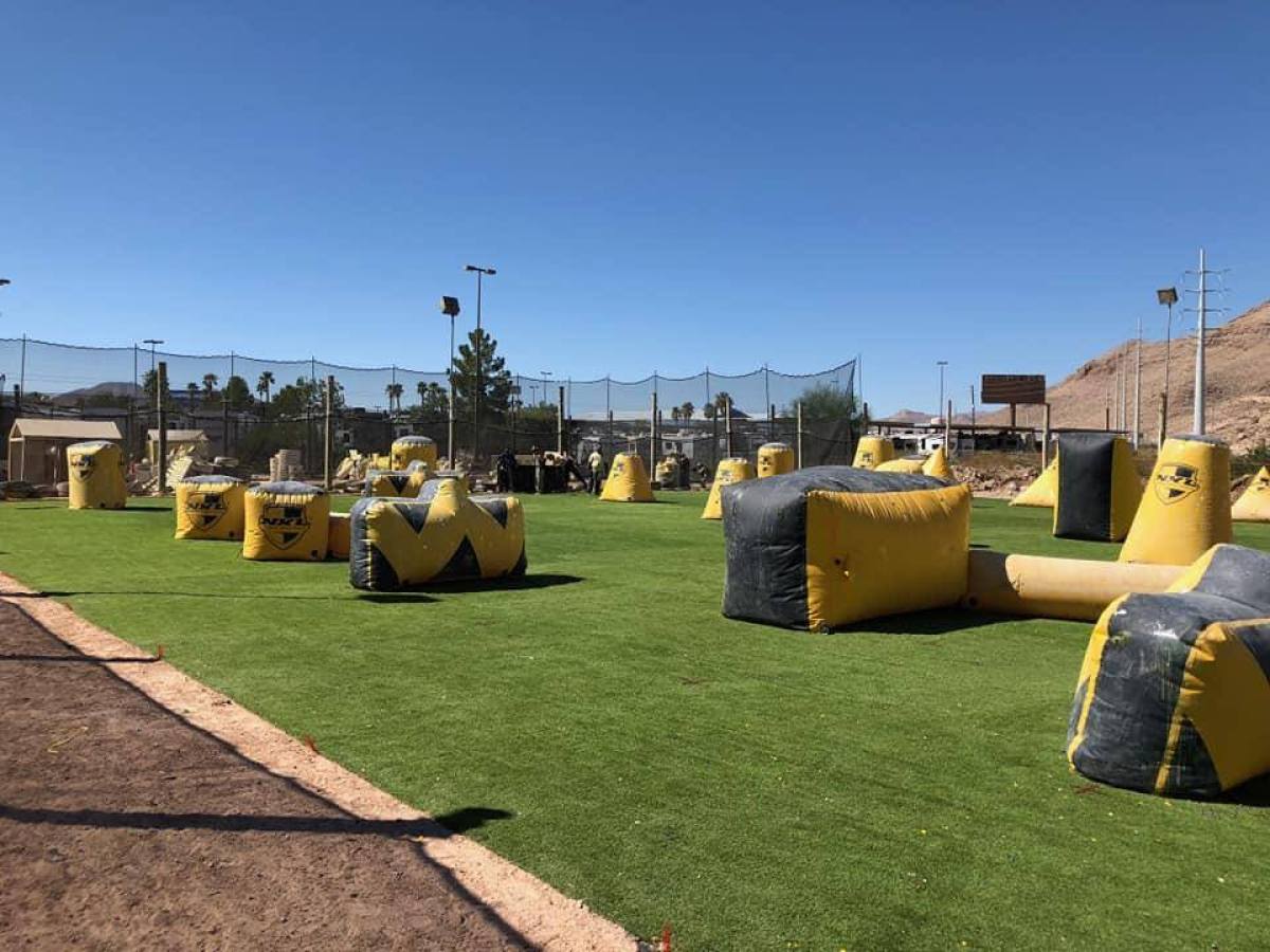 a person sitting on top of a grass covered field