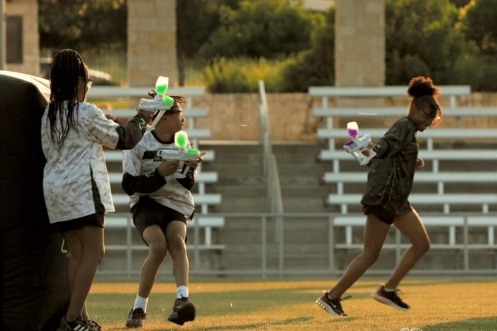 a woman taking a swing at a ball