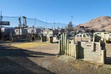 a truck driving down a dirt road