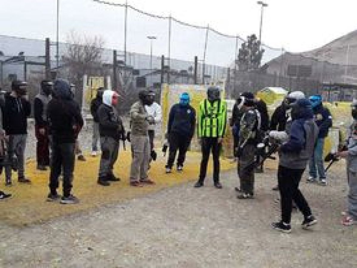 a group of people walking down a street
