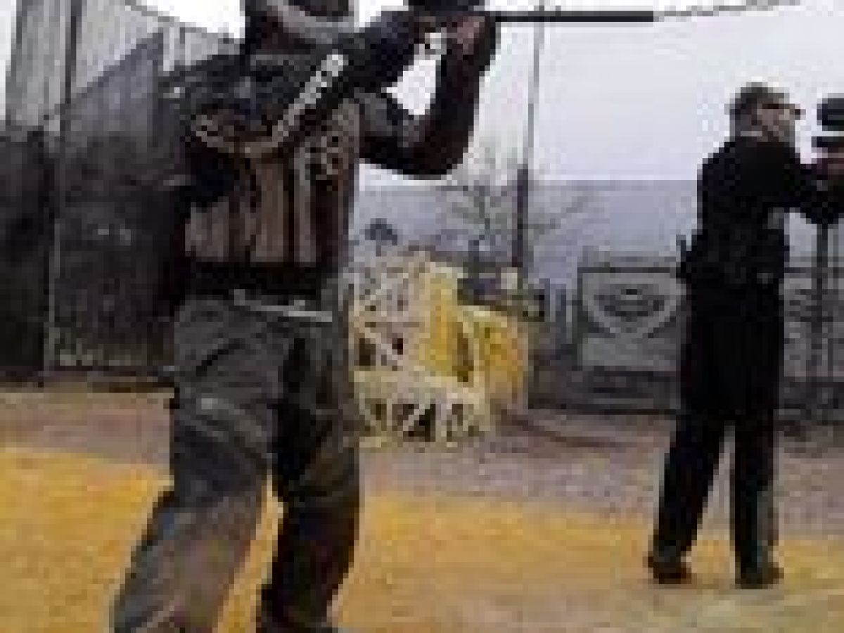 a man that is standing in the dirt