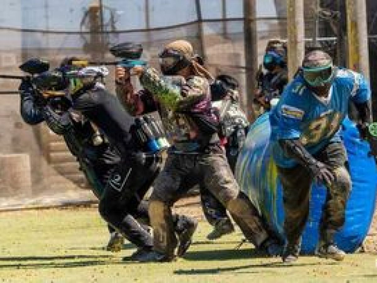 a group of baseball players standing on top of a building