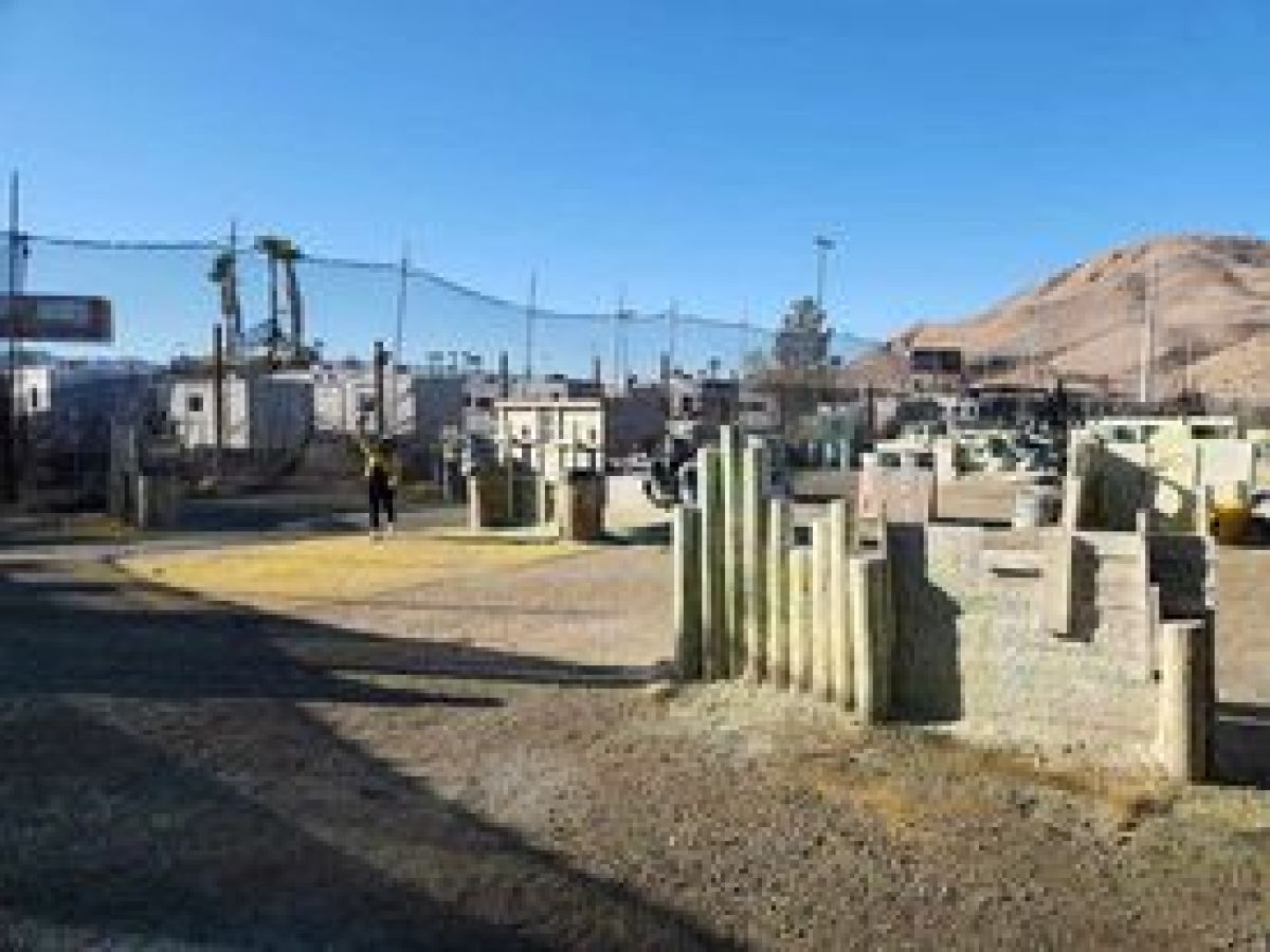 a truck driving down a dirt road