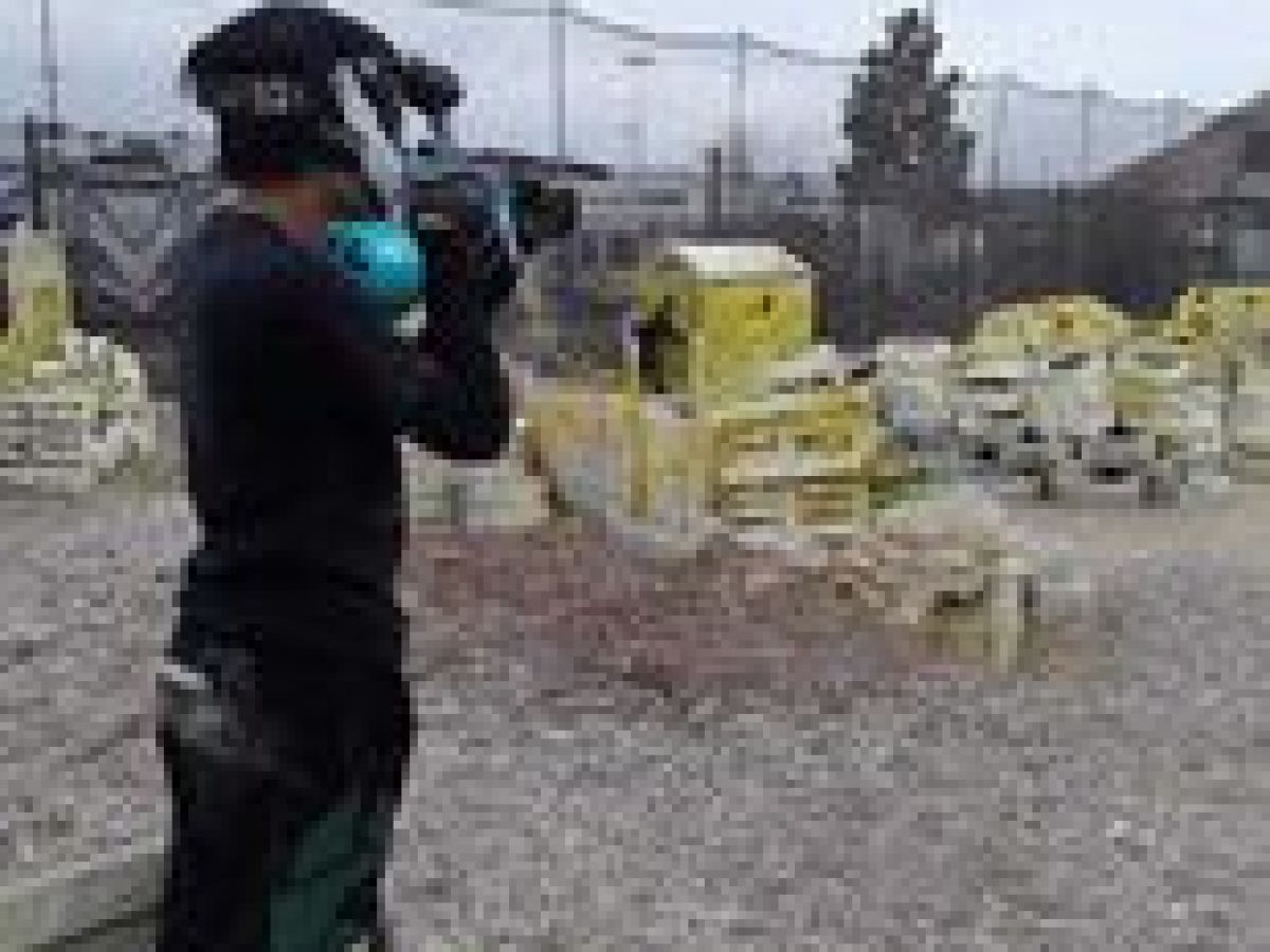 a man that is standing in the dirt