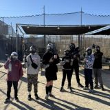 a group of people walking on a bridge